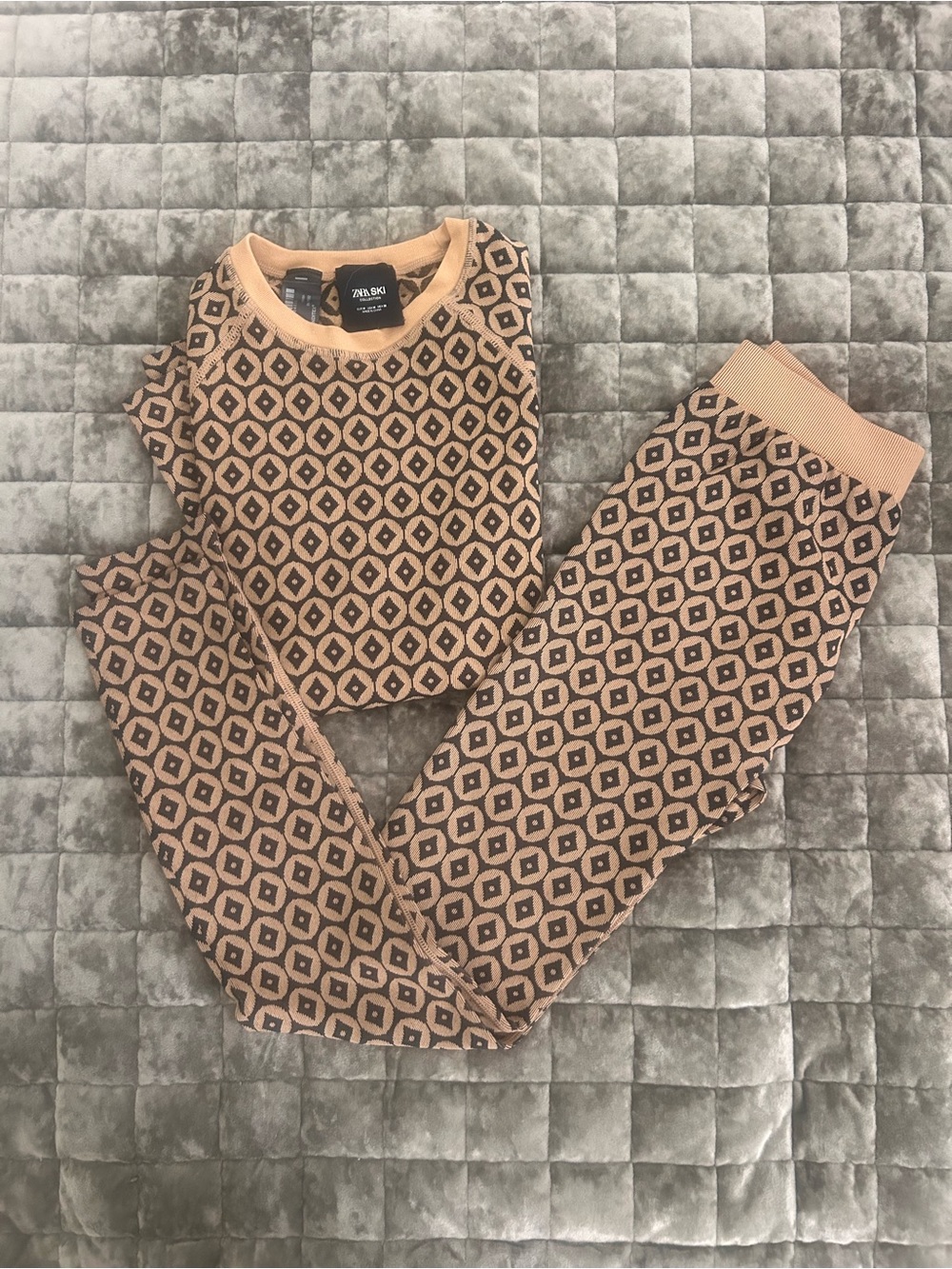 Zara Tan and Black Geometric Ski under layer